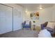 Inviting living room featuring comfortable seating, wall art, and soft carpet at 5863 N Boston St, Denver, CO 80238