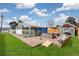 Large backyard patio with outdoor seating, well-maintained lawn, and attractive brick accents at 6190 Garrison St, Arvada, CO 80004