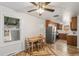 Cozy dining area next to kitchen with hardwood floors and lots of natural light at 6190 Garrison St, Arvada, CO 80004