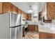 Kitchen with stainless steel appliances, ample cabinetry, and granite countertops at 6190 Garrison St, Arvada, CO 80004