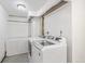 Efficient laundry room with modern washer and dryer, and ample storage space at 6190 Garrison St, Arvada, CO 80004