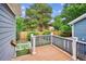 Back deck overlooks landscaped yard and has access to side yard at 8225 W 67Th Pl, Arvada, CO 80004