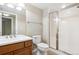 Bright bathroom features shower, vanity, and neutral color scheme at 8225 W 67Th Pl, Arvada, CO 80004