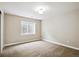 Bedroom has neutral carpet, white trim, and a single window at 8225 W 67Th Pl, Arvada, CO 80004