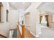 Bright entryway with hardwood floors, decorative arches, and views into other living spaces at 8225 W 67Th Pl, Arvada, CO 80004