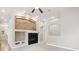 Bright living room features a fireplace, high ceilings, and open layout at 8225 W 67Th Pl, Arvada, CO 80004