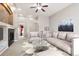 Inviting living room with fireplace, neutral colors, and plush seating, perfect for relaxation at 8225 W 67Th Pl, Arvada, CO 80004
