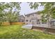 Expansive backyard featuring a wooden deck and a well-maintained lawn, perfect for outdoor entertaining at 334 Octillo St, Brighton, CO 80601