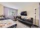 Cozy bedroom with comfortable furniture, natural light, and soft color palette at 334 Octillo St, Brighton, CO 80601