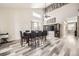 Spacious dining room with high ceilings and large windows provides ample natural light at 334 Octillo St, Brighton, CO 80601