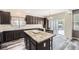 Modern kitchen featuring a spacious island, stainless steel appliances, and ample cabinet space at 334 Octillo St, Brighton, CO 80601