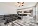Open-concept living room seamlessly blends into the modern kitchen at 334 Octillo St, Brighton, CO 80601