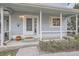 Welcoming front porch with a white picket fence, potted plants, and the house number clearly displayed at 6250 Everett Ct # F, Arvada, CO 80004