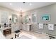 Bathroom boasts dual sinks, a makeup vanity, tile flooring, and bright natural light at 4 Cherry Hills Farm Dr, Cherry Hills Village, CO 80113