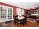Dining area featuring french doors, a round table with chairs, and built-in cabinetry at 4 Cherry Hills Farm Dr, Cherry Hills Village, CO 80113