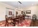 Elegant dining room with a wooden table set and decorative rug at 4 Cherry Hills Farm Dr, Cherry Hills Village, CO 80113