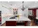 Well-lit kitchen showcasing an island, white cabinets, and modern appliances at 4 Cherry Hills Farm Dr, Cherry Hills Village, CO 80113