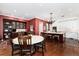 Gourmet kitchen adjacent to a dining area featuring a built-in hutch and marble countertops at 4 Cherry Hills Farm Dr, Cherry Hills Village, CO 80113