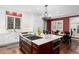 Spacious kitchen featuring a gas cooktop, farmhouse sink, and a cozy breakfast nook at 4 Cherry Hills Farm Dr, Cherry Hills Village, CO 80113