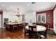 Bright kitchen with a large island, white cabinetry, hardwood floors, and a separate dining area at 4 Cherry Hills Farm Dr, Cherry Hills Village, CO 80113