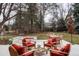 Cozy outdoor seating with fire pit in landscaped backyard at 4 Cherry Hills Farm Dr, Englewood, CO 80113