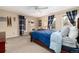 This bedroom features carpet flooring, blue decorative curtains, and natural light at 4 Cherry Hills Farm Dr, Englewood, CO 80113