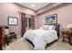 Cozy bedroom featuring unique artwork, a large window and carpet flooring at 4 Cherry Hills Farm Dr, Englewood, CO 80113