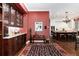 Elegant kitchen featuring wood cabinets, marble countertops, wine storage and decor accents at 4 Cherry Hills Farm Dr, Englewood, CO 80113