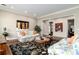 Inviting living room with floral sofas, a decorative rug, and artwork, creating a comfortable ambiance at 4 Cherry Hills Farm Dr, Englewood, CO 80113