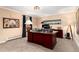 Well-lit home office featuring custom desk, carpet flooring, and decorative lighting at 4 Cherry Hills Farm Dr, Englewood, CO 80113