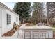 Outdoor kitchen features stone countertops and bar seating at 4 Cherry Hills Farm Dr, Englewood, CO 80113