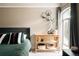 Cozy bedroom features modern decor, a comfortable bed, and a sunny window at 1365 Columbine St # 204, Denver, CO 80206