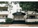 Elegant building entrance with a black awning and well-maintained landscaping at 1365 Columbine St # 204, Denver, CO 80206