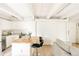 Open living space with kitchen island, sofa, and TV, ideal for modern living at 1365 Columbine St # 204, Denver, CO 80206