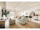 Bright living space featuring a comfortable gray sofa, wood floors, and access to a balcony at 1365 Columbine St # 204, Denver, CO 80206