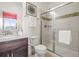 Modern bathroom featuring a glass enclosed shower with decorative tile at 7875 S Grand Baker St, Aurora, CO 80016