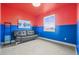 Unique bedroom with bold color scheme, modern furniture, and natural light at 7875 S Grand Baker St, Aurora, CO 80016