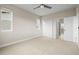 Bright bedroom with ceiling fan, carpet, and three windows allowing lots of natural light at 7875 S Grand Baker St, Aurora, CO 80016