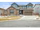 Charming two-story home with a stone accent wall and a two-car garage, perfect for a growing Gathering at 7875 S Grand Baker St, Aurora, CO 80016