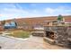 Outdoor stone fireplace and hot tub for an evening of relaxation and entertainment at 7875 S Grand Baker St, Aurora, CO 80016