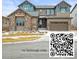 Two story home with a stone facade, a well-maintained yard, and a two-car garage; scan QR code for flythrough video at 7875 S Grand Baker St, Aurora, CO 80016