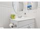 White bathroom vanity with an oval mirror and a tissue box at 2795 S Lansing Way, Aurora, CO 80014