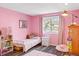 Charming bedroom with pink walls, a twin bed, and plenty of storage at 2795 S Lansing Way, Aurora, CO 80014