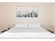 King-size bed in a well lit bedroom with city art at 2795 S Lansing Way, Aurora, CO 80014