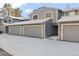 Gray townhouses with attached garages and snow-covered driveway at 2795 S Lansing Way, Aurora, CO 80014