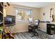 Home office with a desk, chair, and musical instruments at 2795 S Lansing Way, Aurora, CO 80014