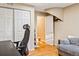 Home office with a desk, chair, and built-in closet at 2795 S Lansing Way, Aurora, CO 80014