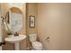 Powder room features pedestal sink, a toilet, and neutral paint at 1146 W 144Th Pl, Westminster, CO 80023