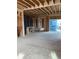 Spacious, unfinished interior framing with exposed ceiling beams and sliding glass door at 15268 Detroit St, Thornton, CO 80602