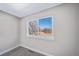 Bright bedroom with neutral walls, plush carpeting, and a large window at 273 E 4Th Ave, Longmont, CO 80504